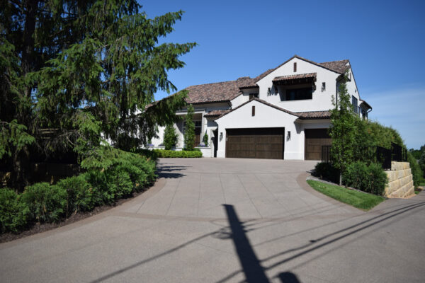 Completed concrete driveway service completed by Concrete Science for a home.