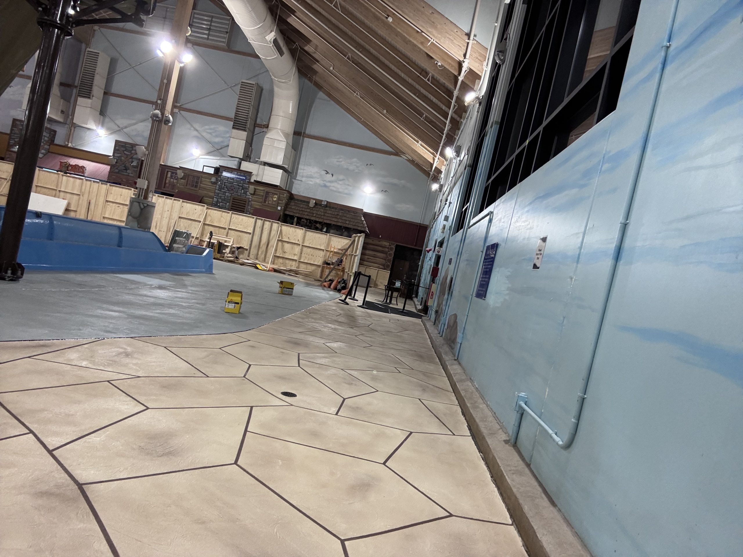 New concrete flooring with slip resistant stone surface added to an indoor water park.
